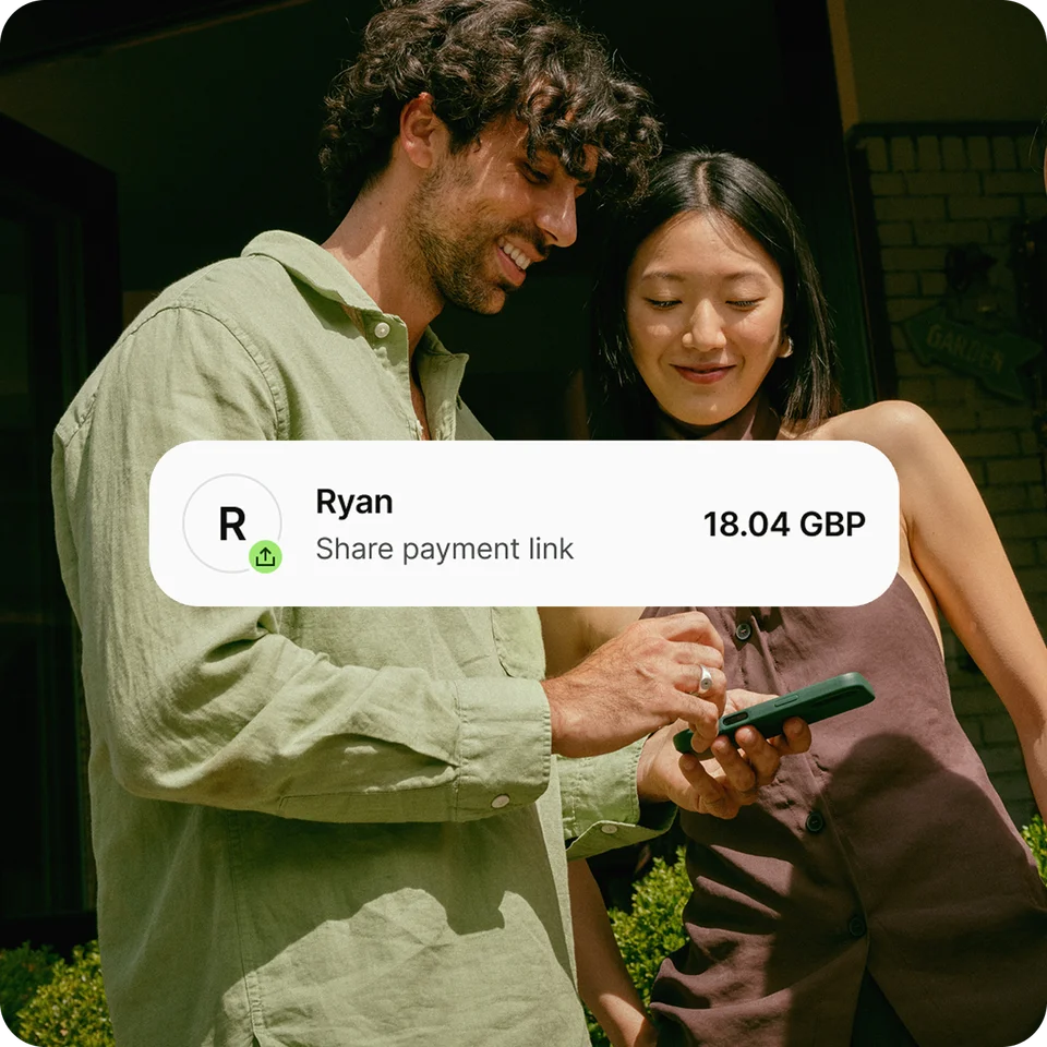 Two friends splitting a bill through the Wise app with a UI overlay indicating the payment link being shared