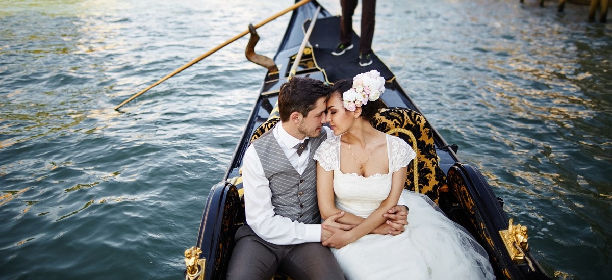 married couple in a gondola in Venice