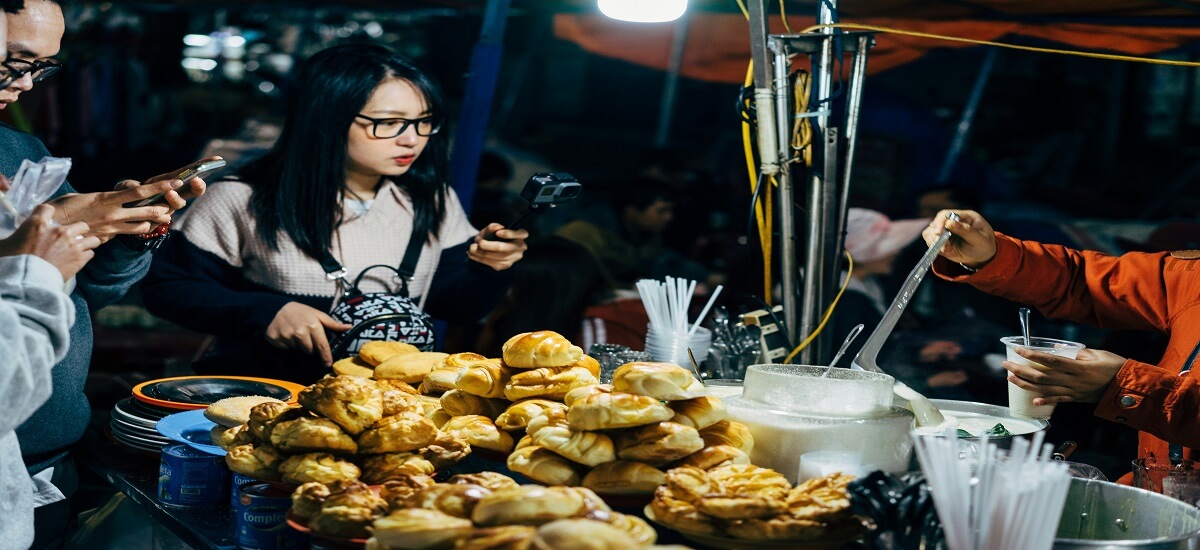 Asian woman buying street food in da lat lam dong vietnam