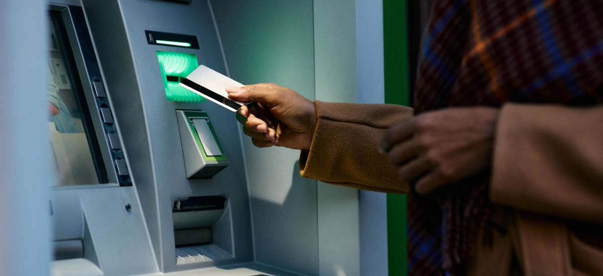 Man using an ATM with card