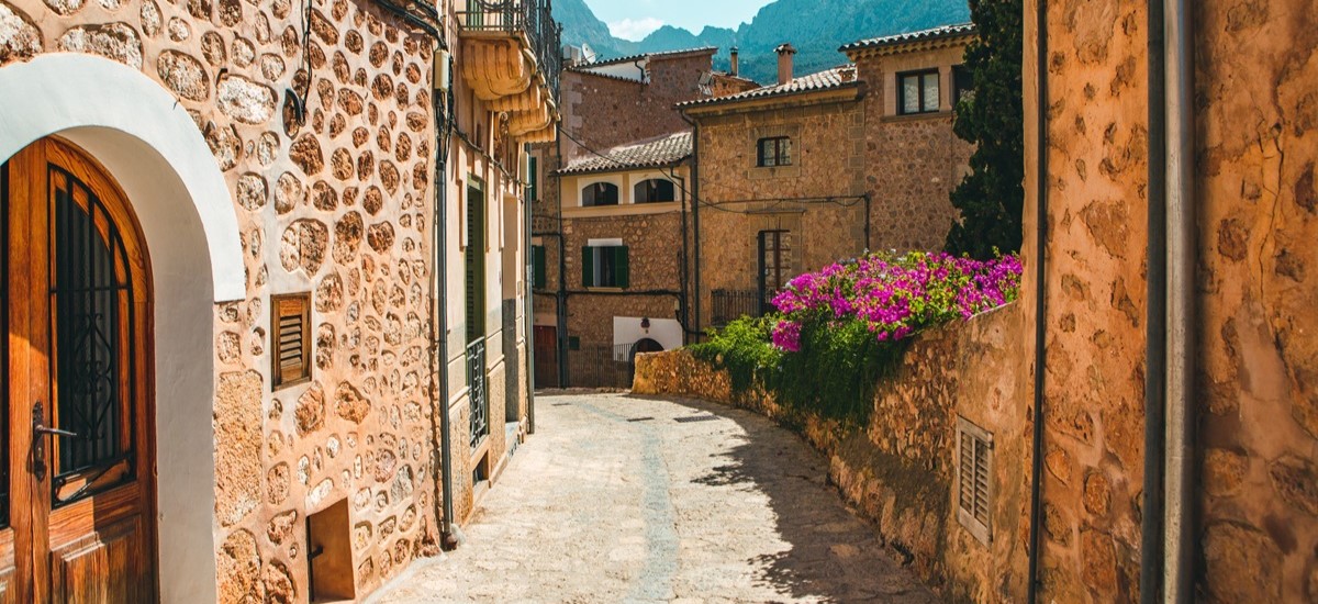 Quiet street in Fornalutx, Mallorca with medieval lookingn houses