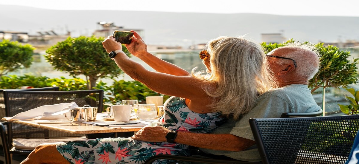 Elderly couple in Greece taking selfie