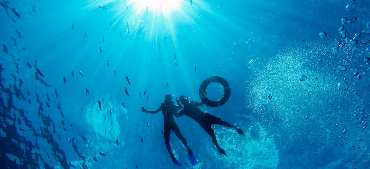 Bottom up view of Divers in Mauritius