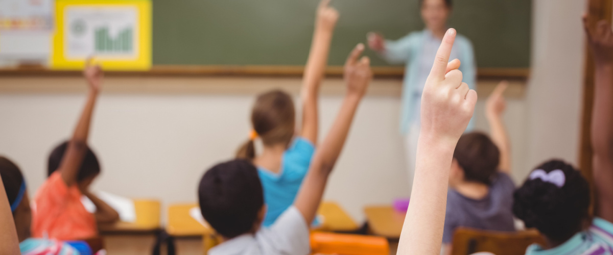 children-raising-hand-classroom