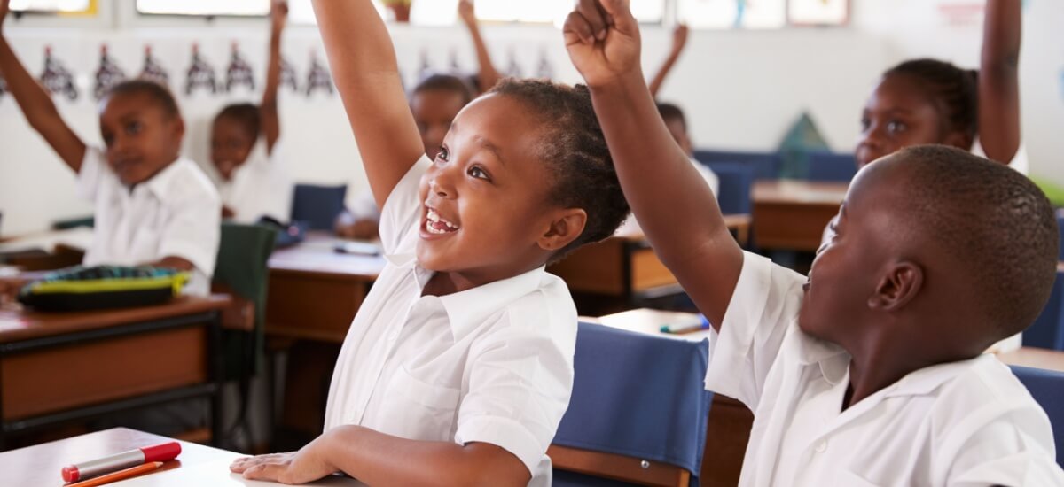 kids-raising-hands-during-elementary-school