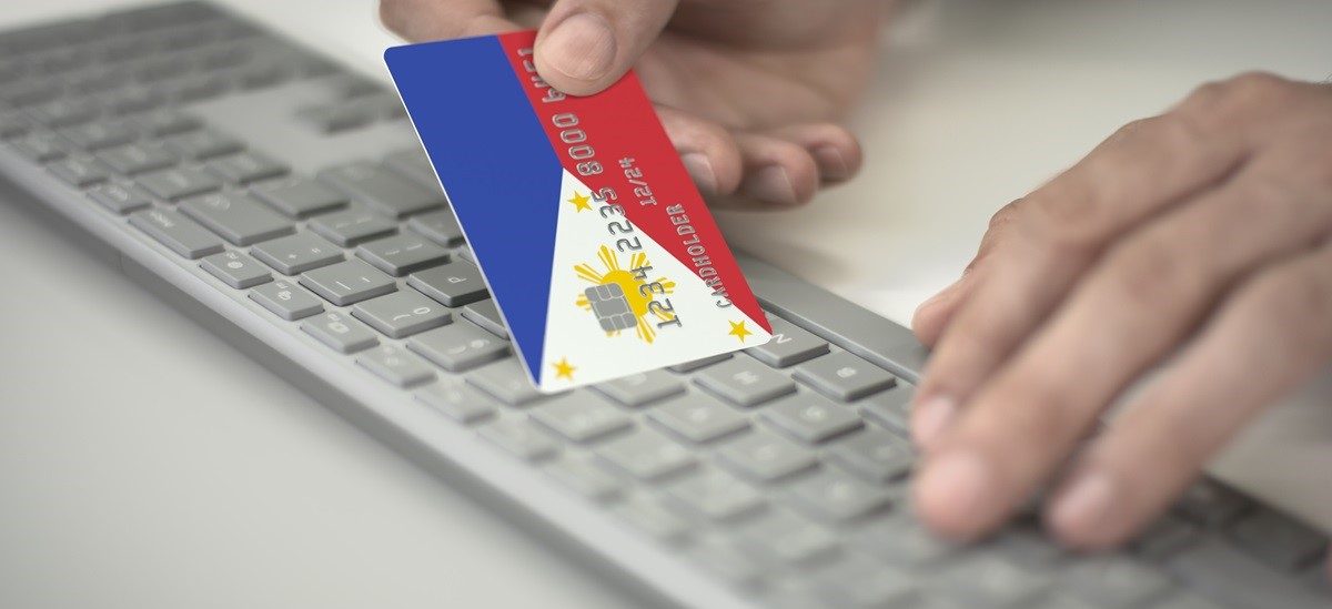 close up on a bank card with a philippines flag design