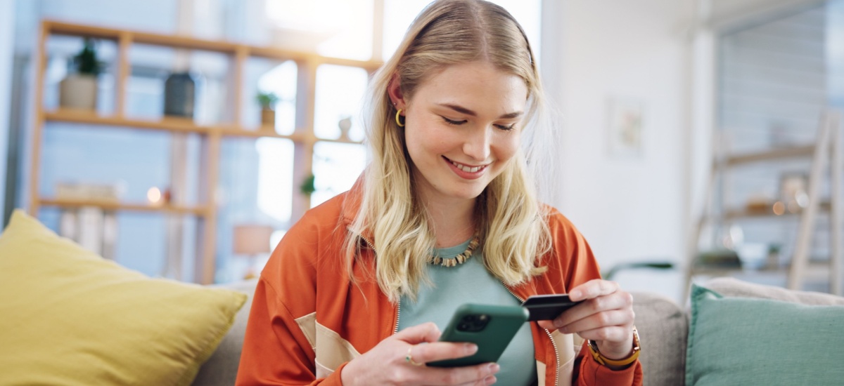 woman-inserting-card-numbers-on-phone