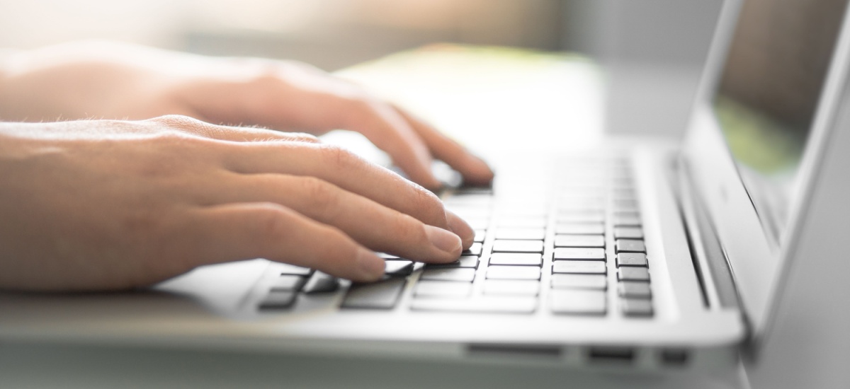 hands-resting-on-laptop-keyboard