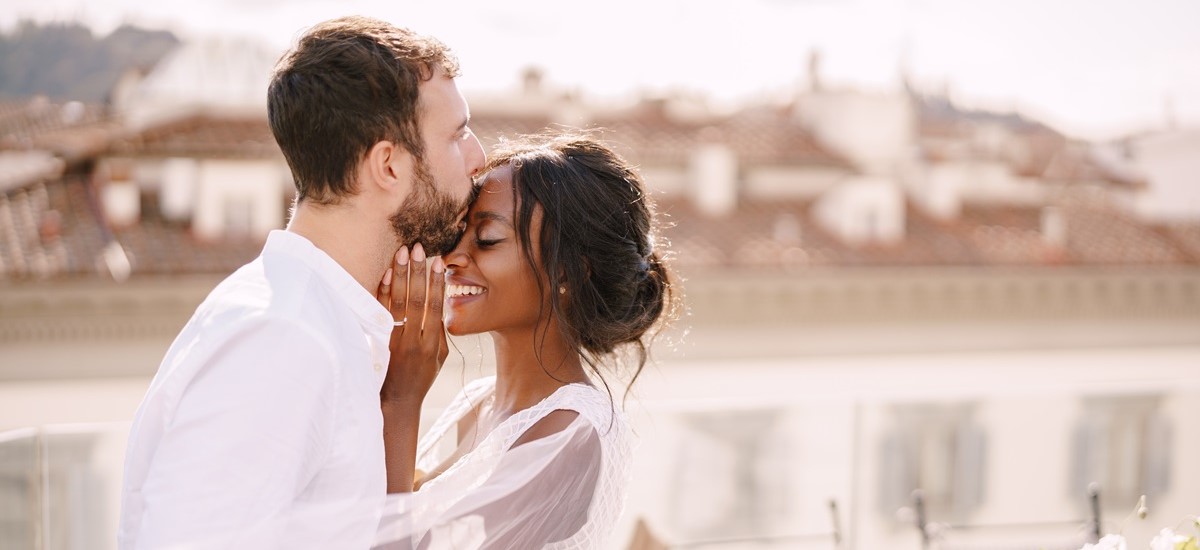 married couple kissing