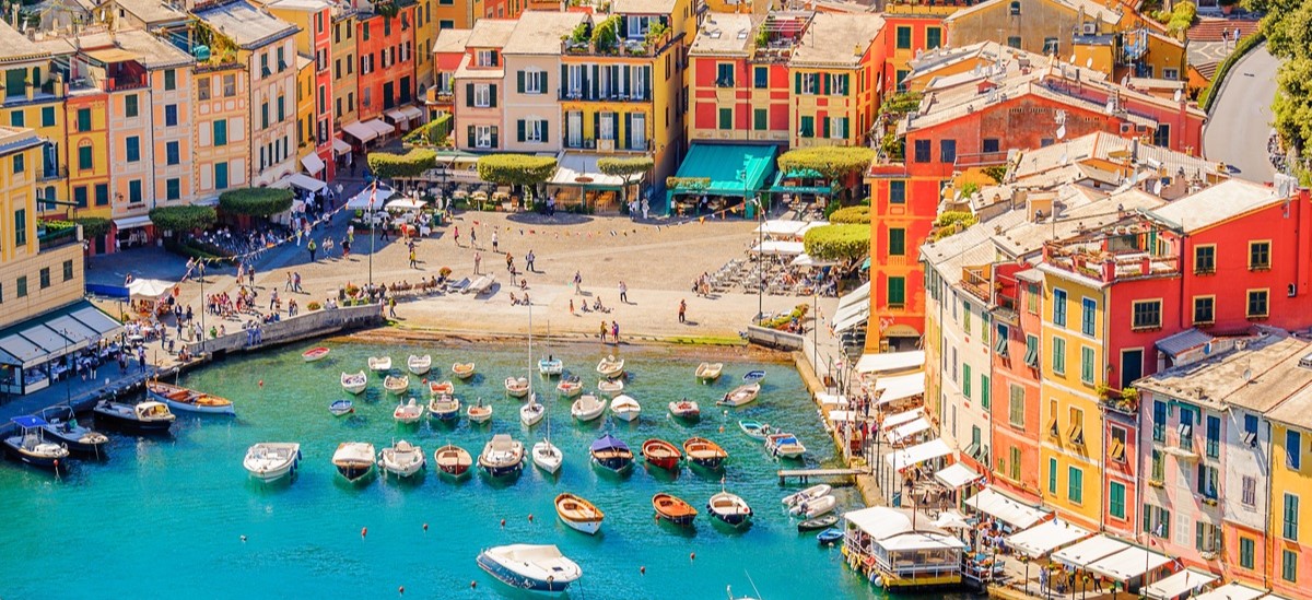 Portofino in Genoa - birds eye view of the coastline with colourful houses and fishing boats
