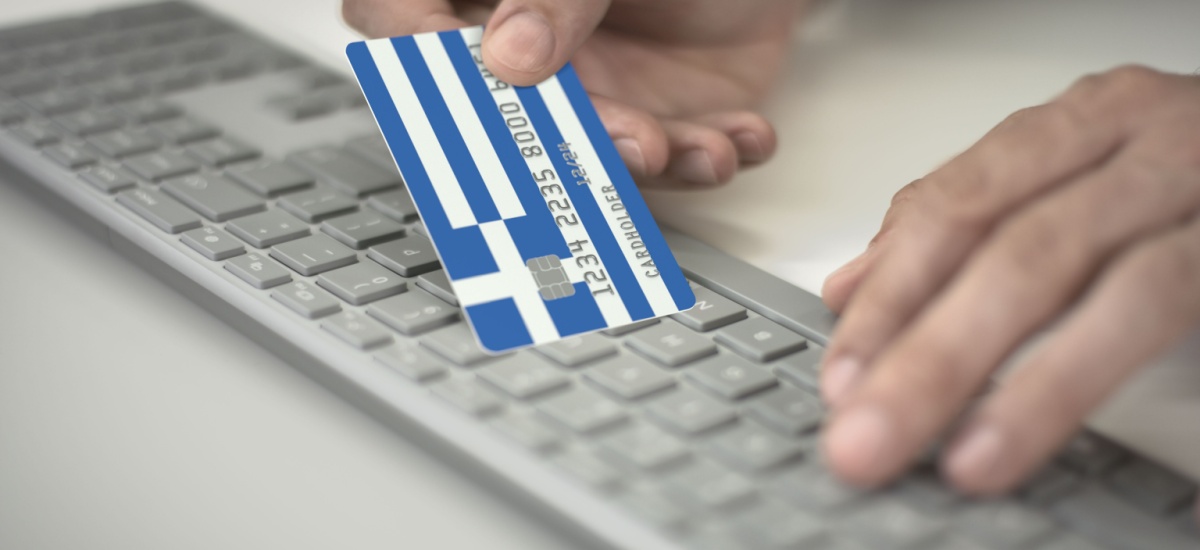 inserting-greece-bank-card-details-on-keyboard