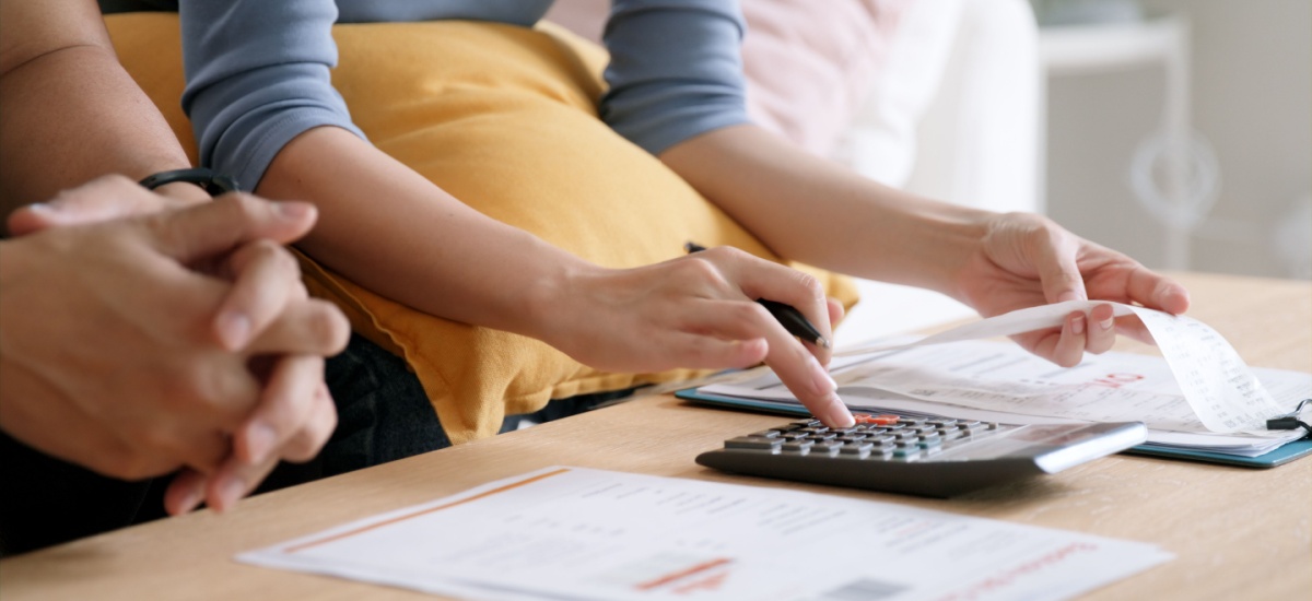 couple-calculating-costs-on-a-calculator