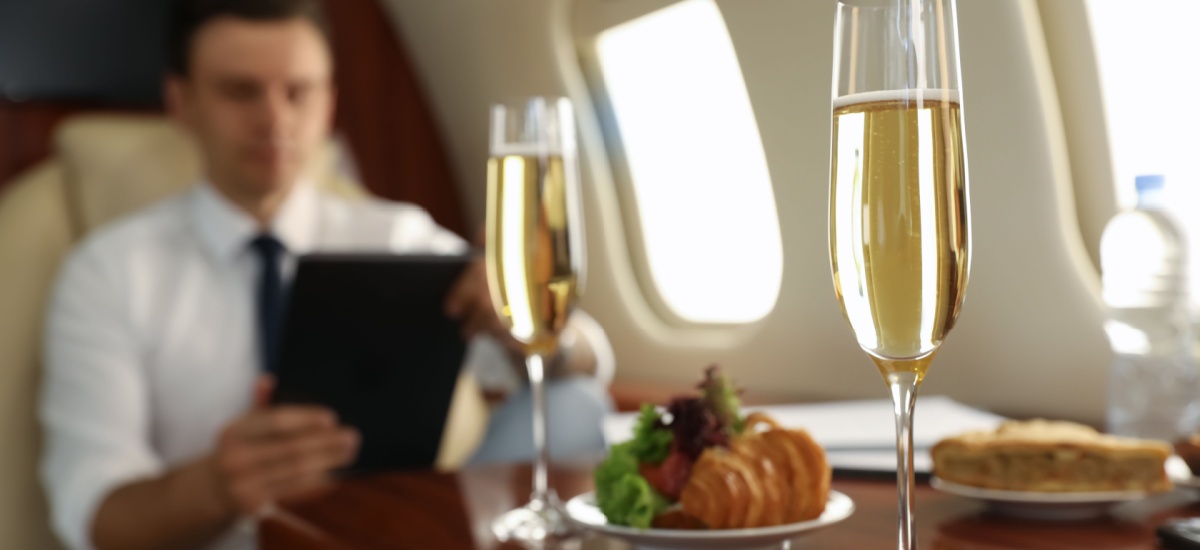 man-working-on-airplane-behind-table