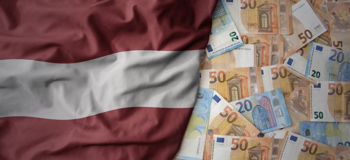 latvian-flag-next-to-euro-notes