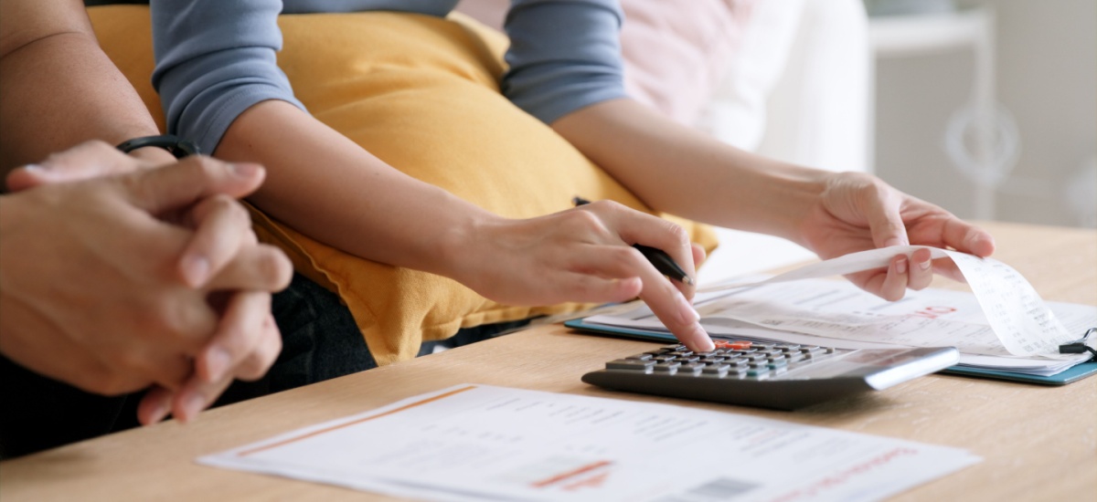 couple-calculating-taxes-for-buying-property