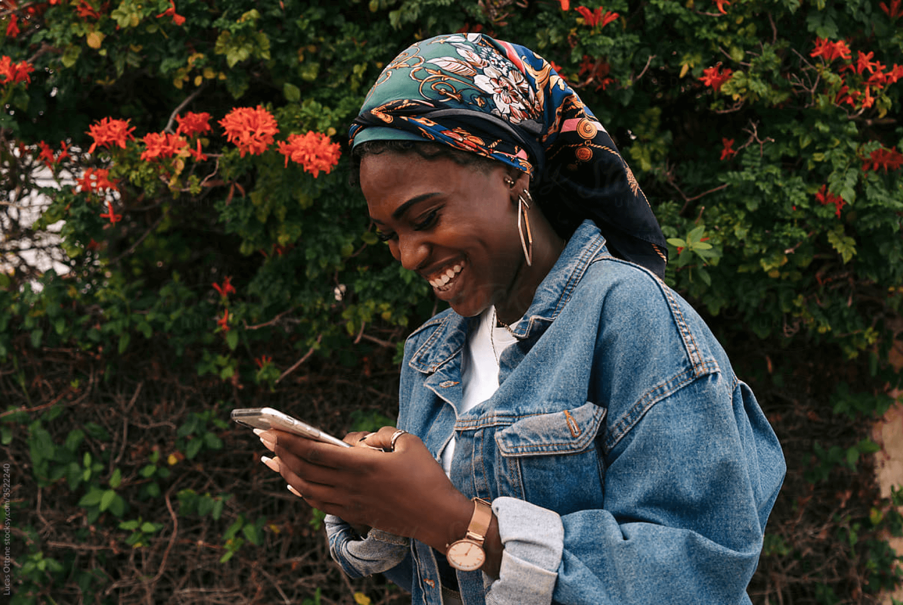 A woman smiling when using the digital wallet