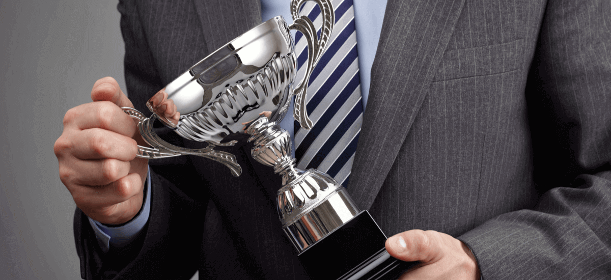 business-man-with-trophy-reward