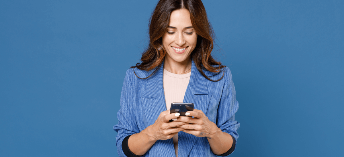woman-with-phone-in-hand-blue-background
