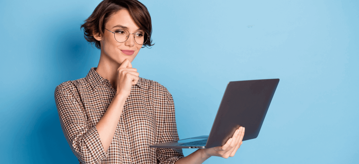 woman-holding-laptop-blue-background