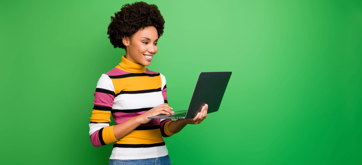 woman-using-laptop-green-background